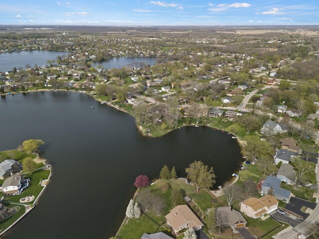 aerial view featuring a water view and a residential view
