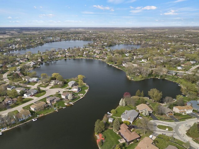 aerial view with a residential view and a water view