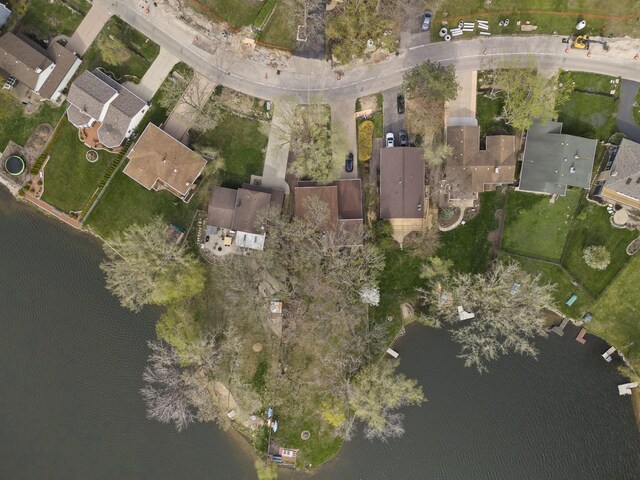 birds eye view of property featuring a water view and a residential view