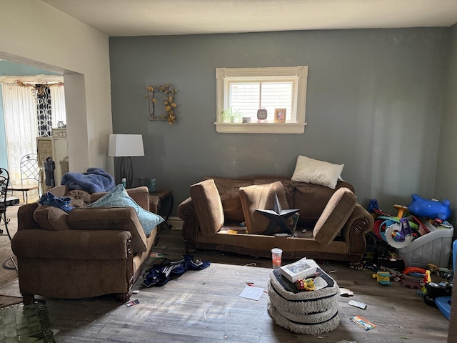 living room with a healthy amount of sunlight and wood finished floors