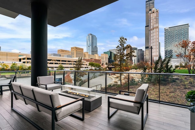 balcony featuring a view of city and an outdoor living space