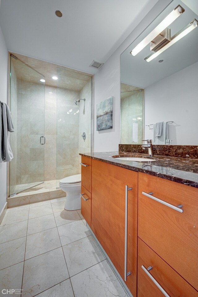 600 N Kingsbury St Unit 1902, Chicago, IL 60654 - full bathroom featuring vanity, a shower stall, toilet, and visible vents