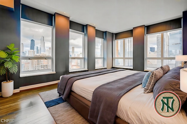 600 N Kingsbury St Unit 1902, Chicago, IL 60654 - bedroom with wood finished floors and a skyline view