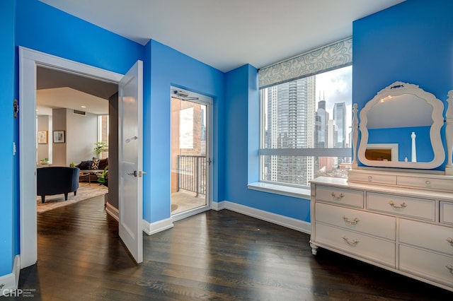 600 N Kingsbury St Unit 1902, Chicago, IL 60654 - bedroom featuring dark wood-style flooring, access to outside, and a skyline view
