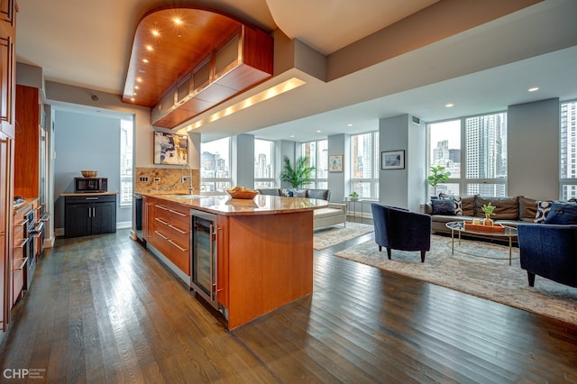 600 N Kingsbury St Unit 1902, Chicago, IL 60654 - kitchen featuring wine cooler, brown cabinets, dark wood finished floors, and open floor plan