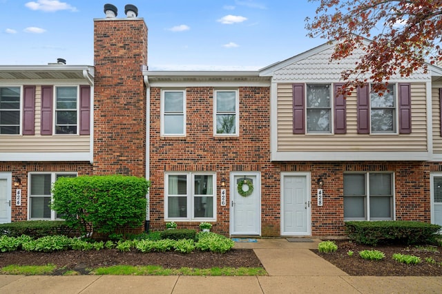 426 Kensington Ct, Naperville, IL 60563 - view of property featuring brick siding and a chimney