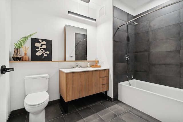 bathroom with tile patterned floors, shower / bath combination, toilet, vanity, and baseboards