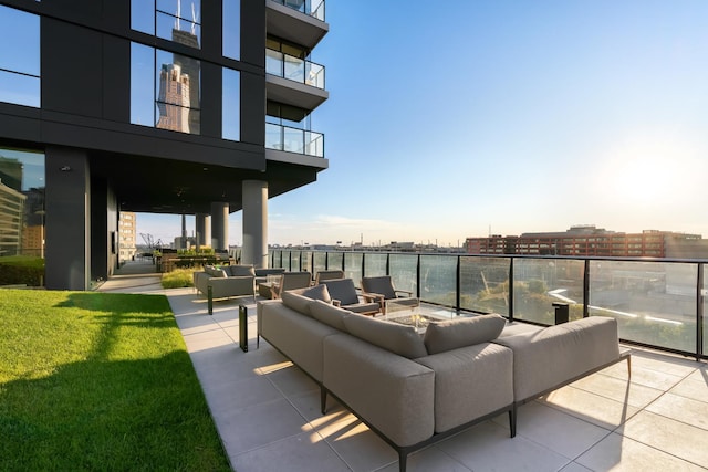 view of patio with an outdoor hangout area and a balcony