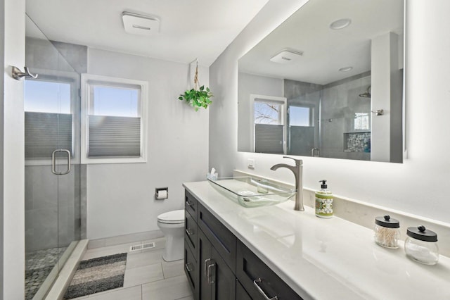 full bathroom featuring visible vents, tile patterned floors, a stall shower, and toilet
