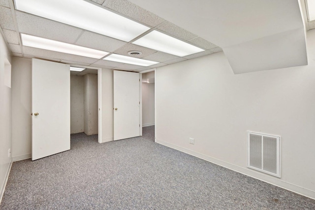 finished basement featuring baseboards, carpet flooring, and visible vents