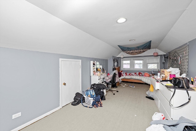 bedroom featuring carpet floors and lofted ceiling