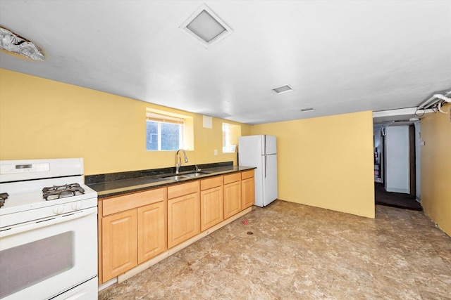 kitchen with white appliances, light floors, a sink, and light brown cabinets