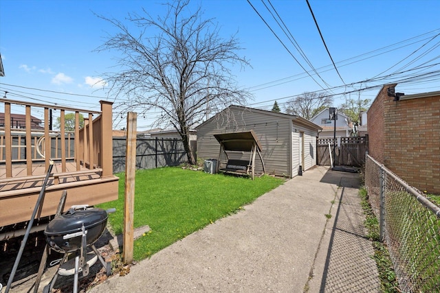 view of yard featuring a fenced backyard and an outdoor structure