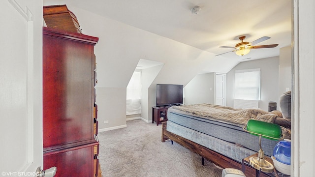 bedroom featuring baseboards, carpet, ceiling fan, and vaulted ceiling