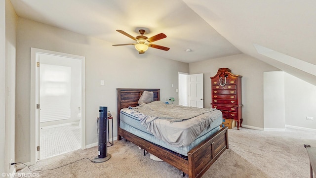 bedroom featuring a ceiling fan, baseboards, light carpet, and vaulted ceiling