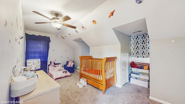 bedroom with carpet floors, visible vents, ceiling fan, and lofted ceiling