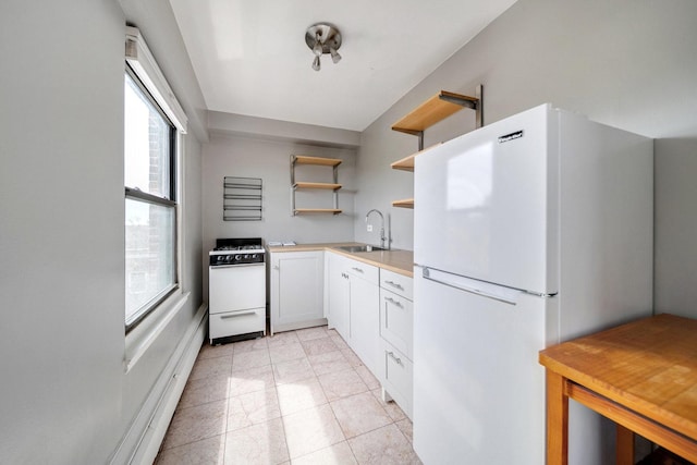 4880 N Marine Dr Unit 614, Chicago, IL 60640 - kitchen with open shelves, a sink, white appliances, light countertops, and vaulted ceiling