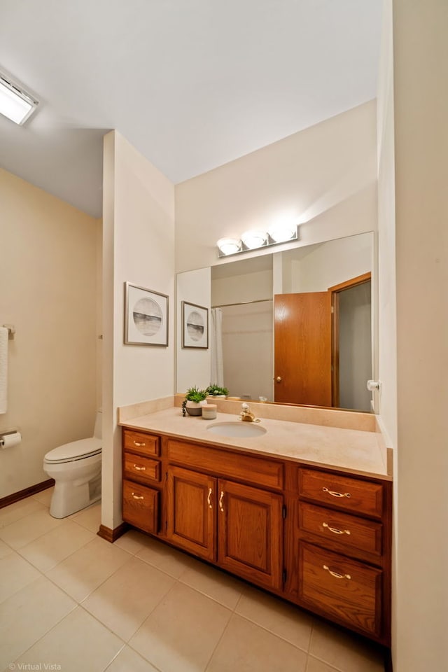 396 Crestwood Rd, Wood Dale, IL 60191 - bathroom featuring tile patterned floors, toilet, vanity, and baseboards