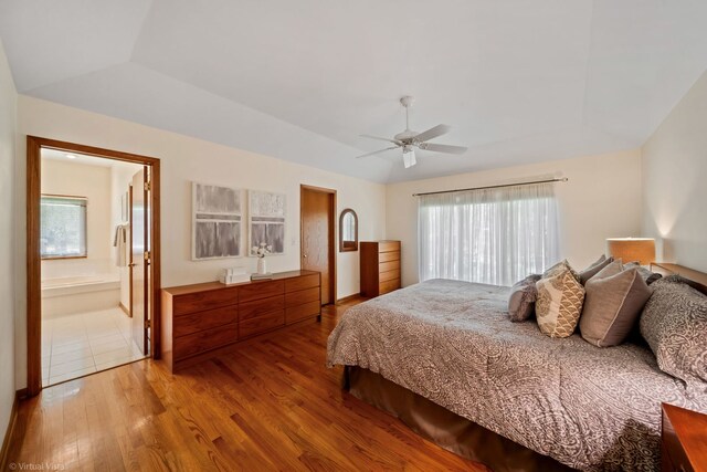 396 Crestwood Rd, Wood Dale, IL 60191 - bedroom with wood finished floors, vaulted ceiling, ceiling fan, and connected bathroom