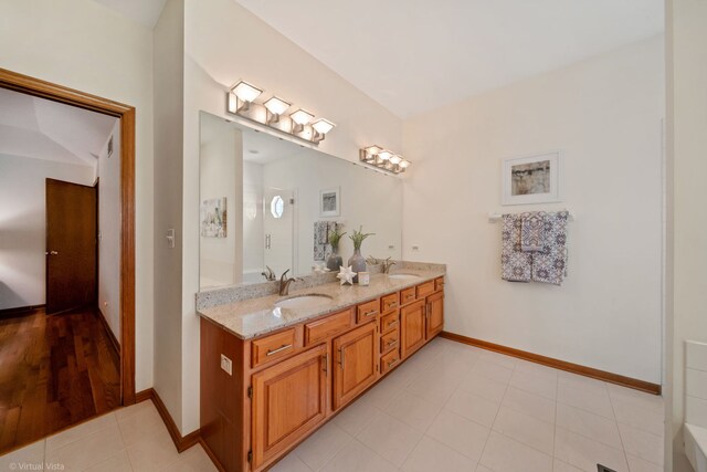 396 Crestwood Rd, Wood Dale, IL 60191 - bathroom with double vanity and baseboards