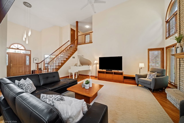 396 Crestwood Rd, Wood Dale, IL 60191 - living area with a towering ceiling, stairway, wood finished floors, healthy amount of natural light, and ceiling fan