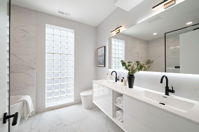 2248 W N Ave Unit 2, Chicago, IL 60647 - bathroom with visible vents, a sink, marble finish floor, and toilet