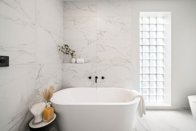 2248 W N Ave Unit 2, Chicago, IL 60647 - full bathroom with marble finish floor, a freestanding tub, and toilet