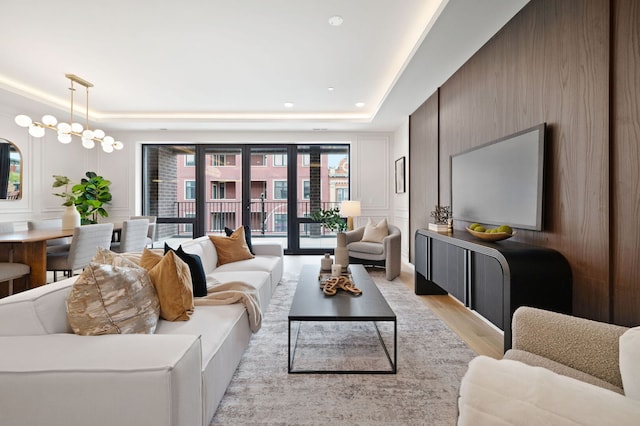 2248 W N Ave Unit 2, Chicago, IL 60647 - living area with light wood-type flooring, recessed lighting, a raised ceiling, and a decorative wall