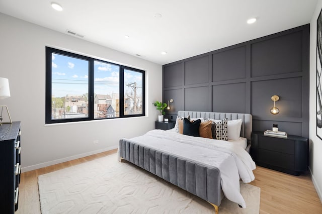 2248 W N Ave Unit 2, Chicago, IL 60647 - bedroom featuring recessed lighting, baseboards, light wood-style flooring, and a decorative wall