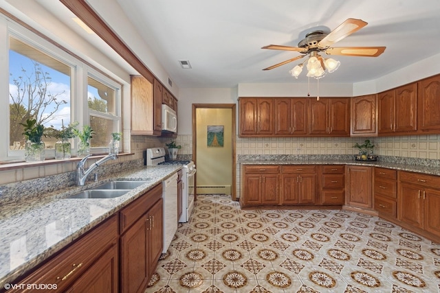 7010 W Devon Ave, Chicago, IL 60631 - kitchen featuring white appliances, a sink, a baseboard heating unit, and tasteful backsplash