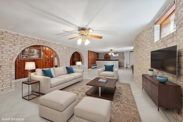 7010 W Devon Ave, Chicago, IL 60631 - living area featuring ceiling fan, light tile patterned floors, and arched walkways