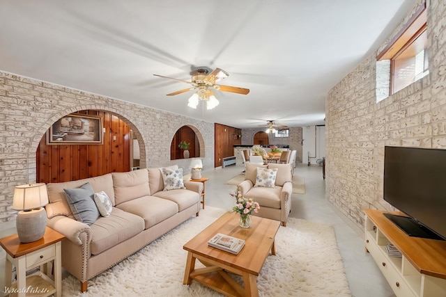 7010 W Devon Ave, Chicago, IL 60631 - living area with arched walkways, a ceiling fan, and healthy amount of natural light