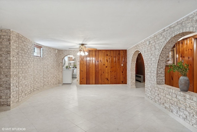 7010 W Devon Ave, Chicago, IL 60631 - unfurnished living room with a ceiling fan and arched walkways