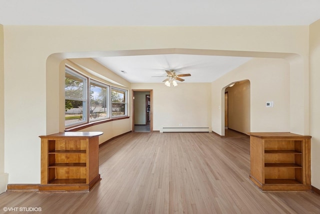 7010 W Devon Ave, Chicago, IL 60631 - unfurnished living room featuring arched walkways, light wood finished floors, a baseboard radiator, ceiling fan, and baseboards