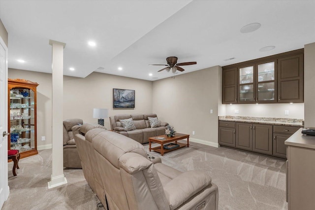 living area with light carpet, baseboards, a ceiling fan, and recessed lighting