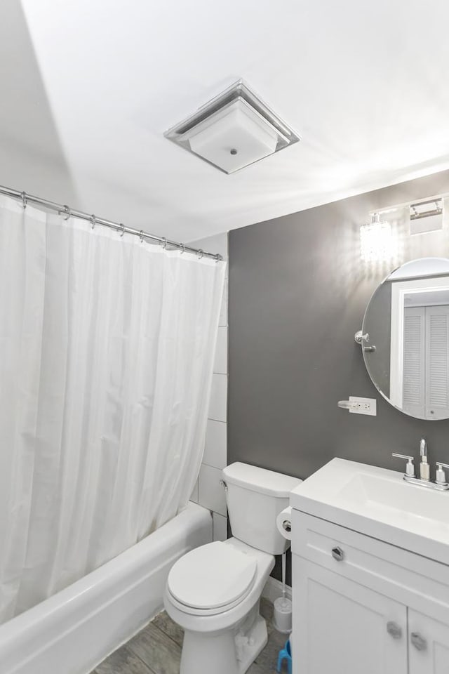 900 Center St Unit 2I, Des Plaines, IL 60016 - bathroom featuring shower / bath combo with shower curtain, toilet, and vanity