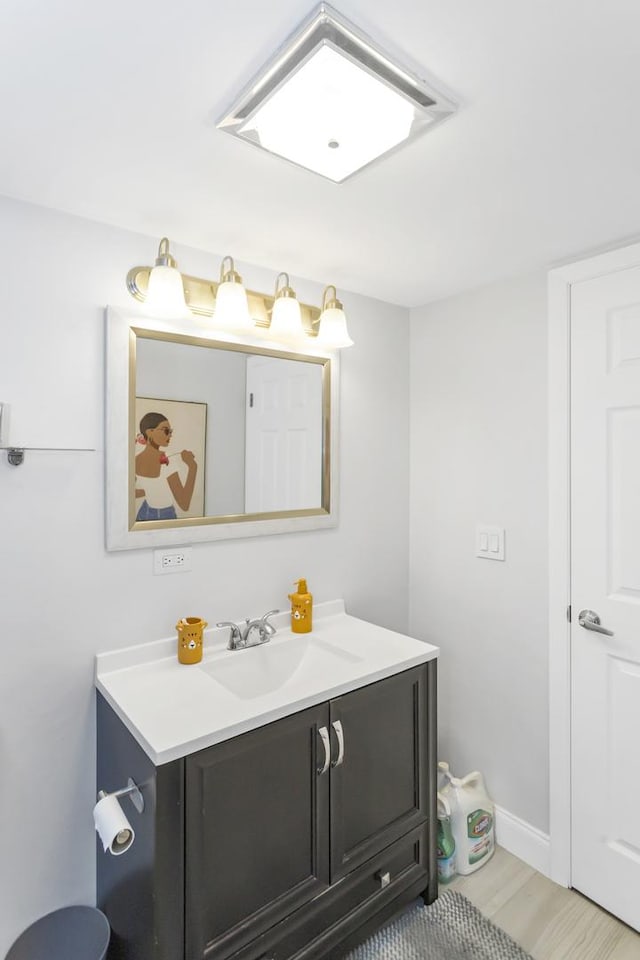 900 Center St Unit 2I, Des Plaines, IL 60016 - bathroom with vanity, baseboards, and wood finished floors