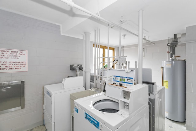 900 Center St Unit 2I, Des Plaines, IL 60016 - clothes washing area with water heater, concrete block wall, independent washer and dryer, and a sink