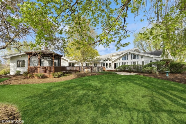 view of yard with a gazebo and a wooden deck