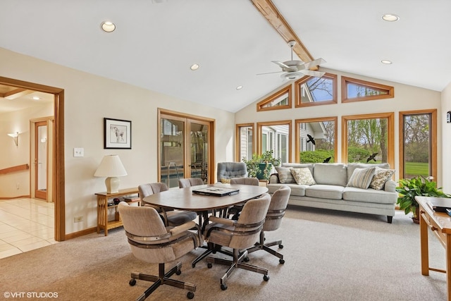dining space with a healthy amount of sunlight, ceiling fan, light carpet, and beam ceiling