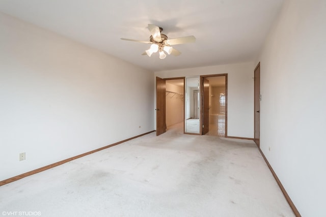unfurnished bedroom with baseboards, a closet, and light colored carpet