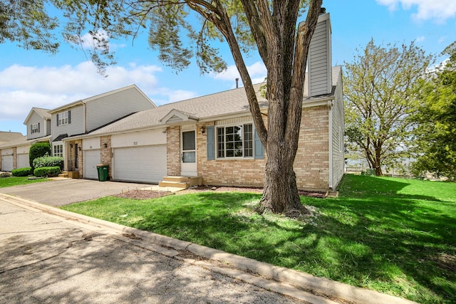 713 Arbury Ct, Romeoville, IL 60446 - view of front facade featuring brick siding, an attached garage, and a front lawn