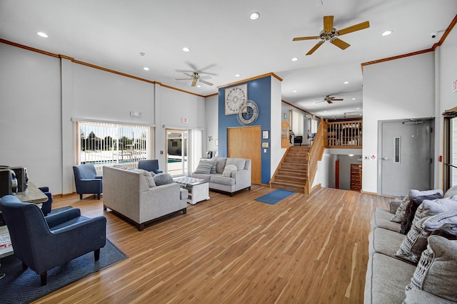 713 Arbury Ct, Romeoville, IL 60446 - living area with a ceiling fan, a high ceiling, ornamental molding, recessed lighting, and light wood finished floors
