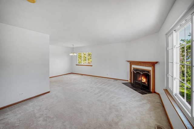 713 Arbury Ct, Romeoville, IL 60446 - unfurnished living room with carpet floors, a chandelier, a fireplace with flush hearth, and baseboards