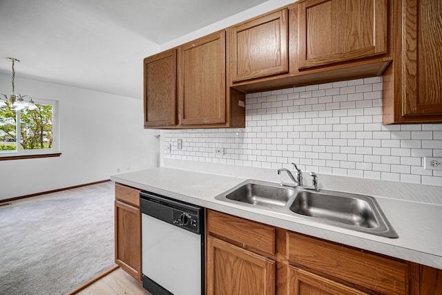 713 Arbury Ct, Romeoville, IL 60446 - kitchen with dishwasher, a sink, light countertops, brown cabinets, and light colored carpet