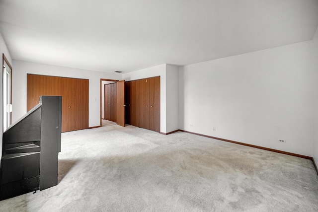 713 Arbury Ct, Romeoville, IL 60446 - unfurnished living room featuring light colored carpet and baseboards