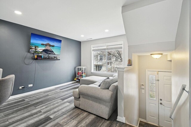 foyer entrance featuring baseboards, recessed lighting, and wood finished floors