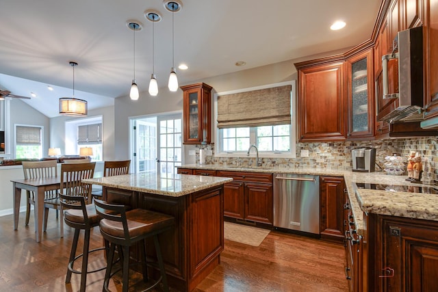 2550 Bayswater Cir, Gurnee, IL 60031 - kitchen featuring dishwasher, a sink, backsplash, plenty of natural light, and vaulted ceiling