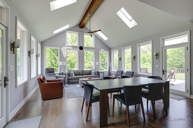 2550 Bayswater Cir, Gurnee, IL 60031 - dining room with a skylight, beamed ceiling, hardwood / wood-style floors, high vaulted ceiling, and baseboards