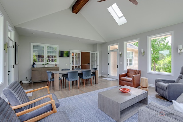2550 Bayswater Cir, Gurnee, IL 60031 - living area featuring beamed ceiling, light wood-type flooring, a skylight, high vaulted ceiling, and ceiling fan